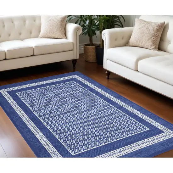 Blue And Ivory Geometric Distressed Area Rug Photo 1