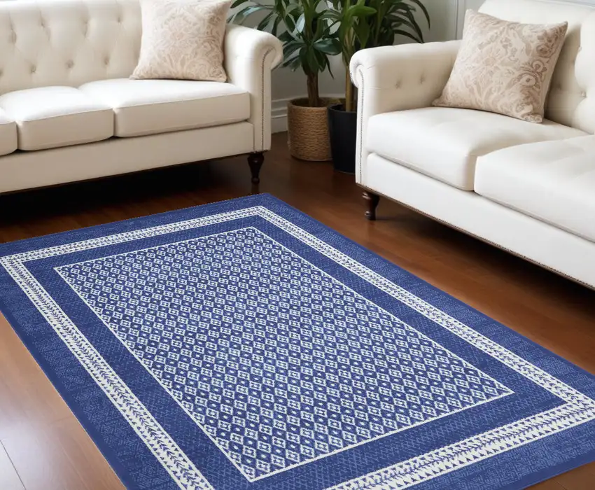 Blue And Ivory Geometric Distressed Area Rug Photo 1