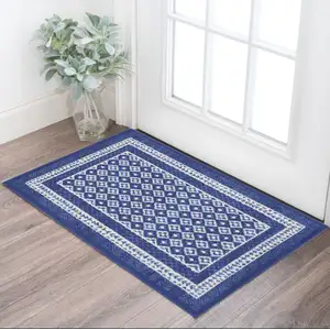 Photo of Blue And Ivory Geometric Distressed Area Rug