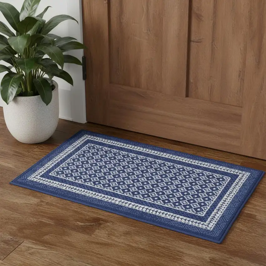 Blue And Ivory Geometric Distressed Area Rug Photo 1