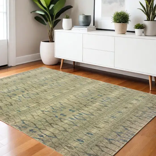 Blue And Ivory Geometric Distressed Area Rug Photo 1
