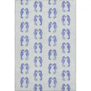 Photo of Blue And Ivory Geometric Washable Area Rug With UV Protection