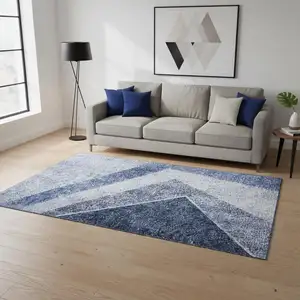 Photo of Blue And Ivory Geometric Washable Area Rug With UV Protection