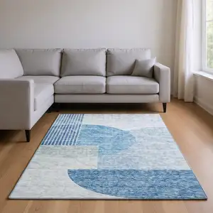 Photo of Blue And Ivory Geometric Washable Area Rug With UV Protection