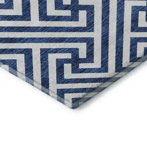 Photo of Blue And Ivory Geometric Washable Area Rug With UV Protection