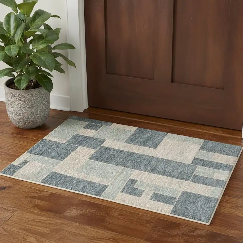 Blue And Ivory Geometric Washable Area Rug Photo 1