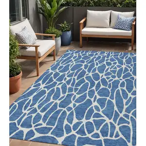 Photo of Blue And Ivory Geometric Washable Indoor Outdoor Area Rug