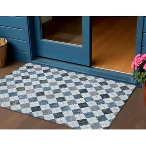 Photo of Blue And Ivory Geometric Washable Indoor Outdoor Area Rug