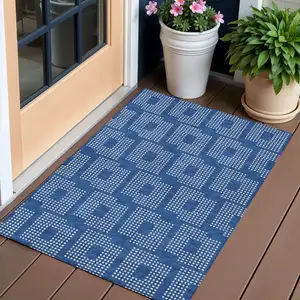 Photo of Blue And Ivory Geometric Washable Indoor Outdoor Area Rug