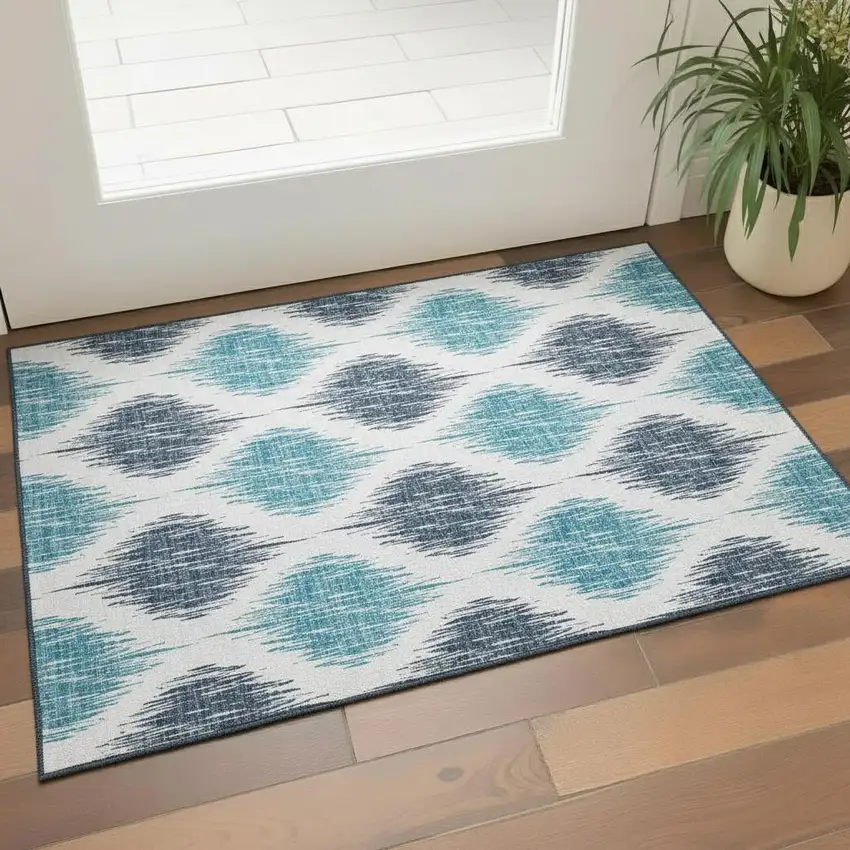 Blue And Ivory Ikat Washable Area Rug With UV Protection Photo 1