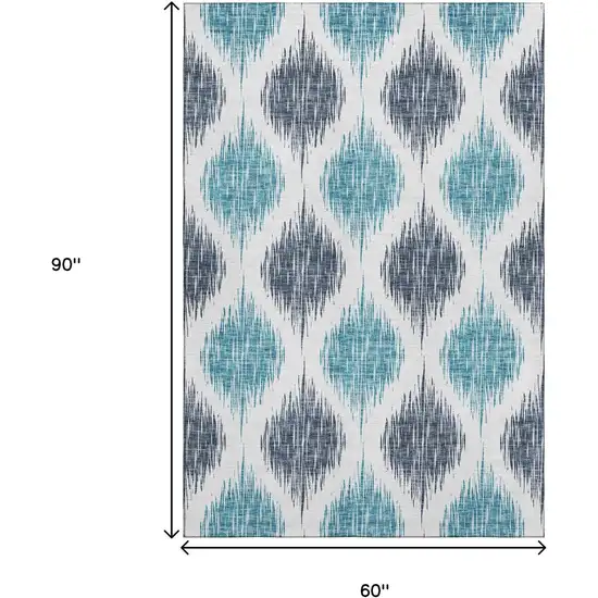 Blue And Ivory Ikat Washable Area Rug With UV Protection Photo 3