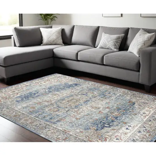 Blue And Ivory Medallion Distressed Area Rug Photo 1