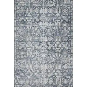 Photo of Blue And Ivory Oriental Washable Area Rug With UV Protection