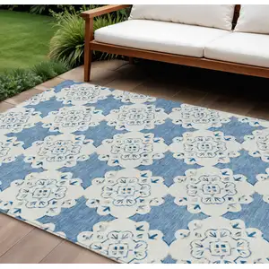 Photo of Blue And Ivory Quatrefoil Washable Indoor Outdoor Area Rug