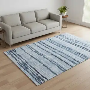 Photo of Blue And Ivory Striped Washable Area Rug With UV Protection
