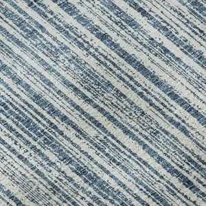 Photo of Blue And Ivory Striped Washable Area Rug With UV Protection