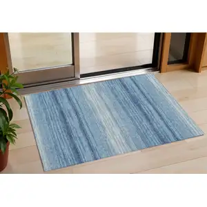 Photo of Blue And Ivory Striped Washable Indoor Outdoor Area Rug