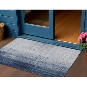 Photo of Blue And Ivory Striped Washable Indoor Outdoor Area Rug