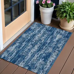 Photo of Blue And Ivory Striped Washable Indoor Outdoor Area Rug