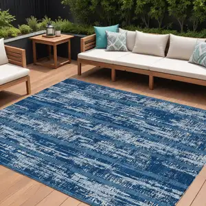 Photo of Blue And Ivory Striped Washable Indoor Outdoor Area Rug