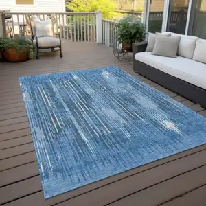 Photo of Blue And Ivory Striped Washable Indoor Outdoor Area Rug