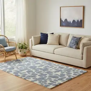 Photo of Blue And Ivory Wool Abstract Hand Tufted Area Rug