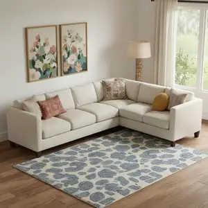 Photo of Blue And Ivory Wool Abstract Hand Tufted Area Rug