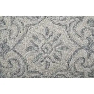 Photo of Blue And Ivory Wool Paisley Tufted Handmade Stain Resistant Area Rug