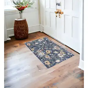 Photo of Blue And Pink Floral Distressed Washable Non Skid Area Rug