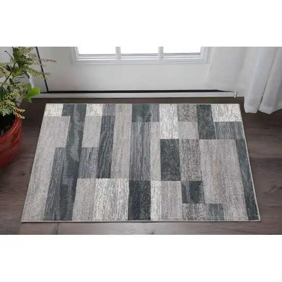 Blue And Taupe Patchwork Distressed Area Rug Photo 1