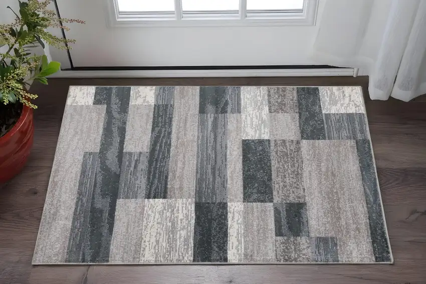Blue And Taupe Patchwork Distressed Area Rug Photo 1