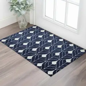 Photo of Blue And White Geometric Washable Area Rug With UV Protection