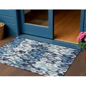 Photo of Blue Aqua And Ivory Striped Washable Indoor Outdoor Area Rug