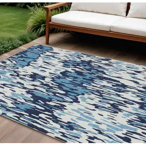 Photo of Blue Aqua And Ivory Striped Washable Indoor Outdoor Area Rug