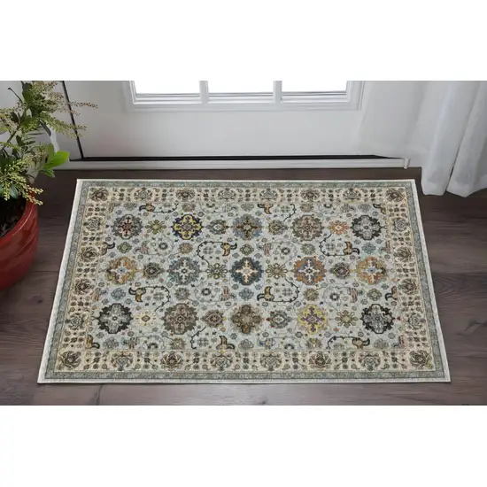 Blue Beige Grey Green Yellow And Rust Oriental Power Loom Stain Resistant Area Rug With Fringe Photo 1