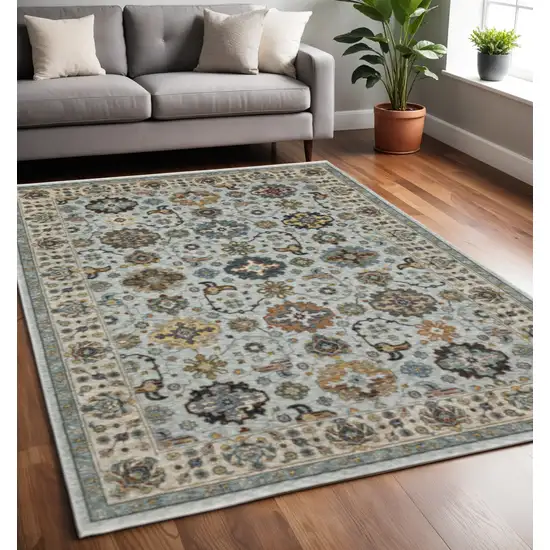 Blue Beige Grey Green Yellow And Rust Oriental Power Loom Stain Resistant Area Rug With Fringe Photo 1