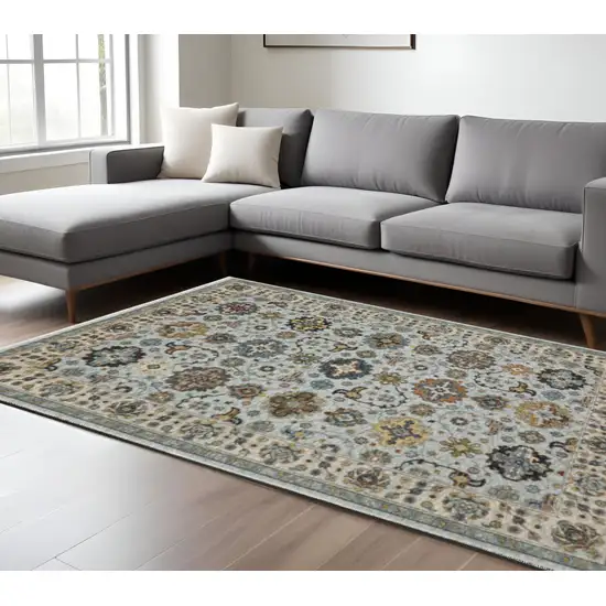 Blue Beige Grey Green Yellow And Rust Oriental Power Loom Stain Resistant Area Rug With Fringe Photo 1