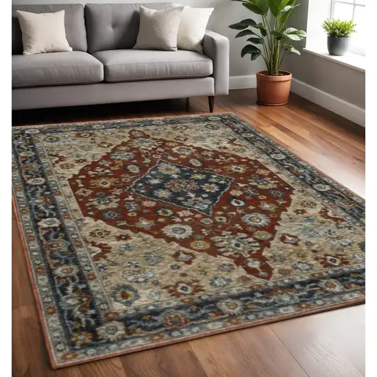 Blue Beige Tan Brown Gold And Rust Red Oriental Power Loom Stain Resistant Area Rug With Fringe Photo 1