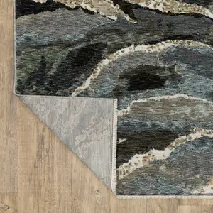 Photo of Blue Black And Beige Abstract Area Rug With Fringe