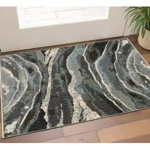 Photo of Blue Black And Beige Abstract Area Rug With Fringe