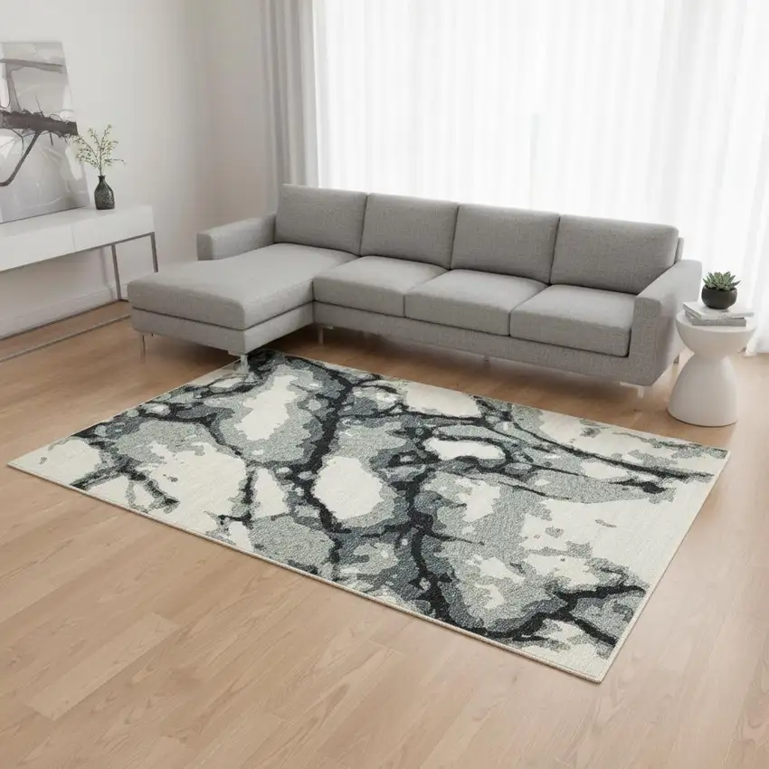 Blue Black And Ivory Abstract Area Rug With Fringe Photo 1