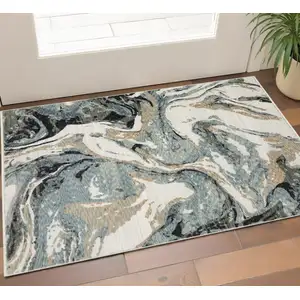 Photo of Blue Black And Ivory Abstract Area Rug With Fringe