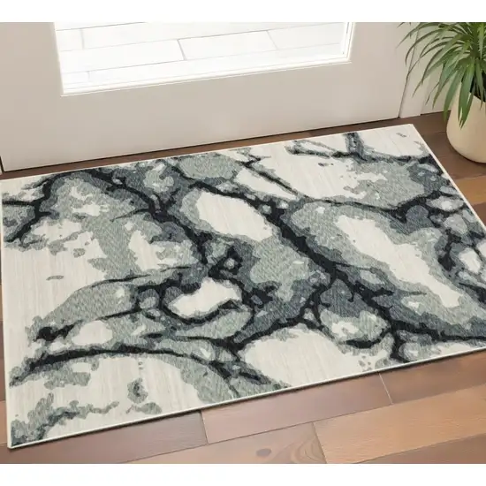 Blue Black And Ivory Abstract Area Rug With Fringe Photo 1