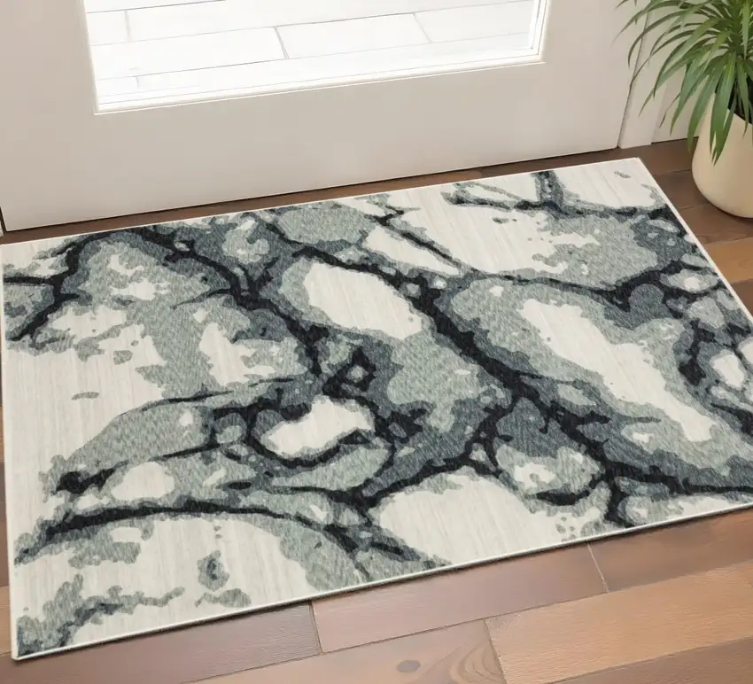 Blue Black And Ivory Abstract Area Rug With Fringe Photo 1