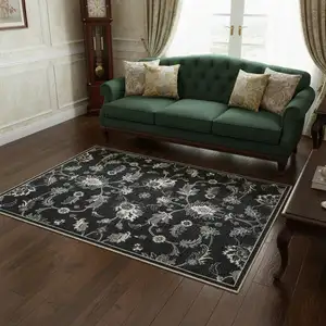 Photo of Blue Black And Ivory Floral Area Rug With Fringe