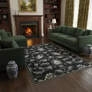 Photo of Blue Black And Ivory Floral Area Rug With Fringe