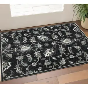 Photo of Blue Black And Ivory Floral Area Rug With Fringe