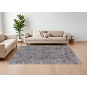 Photo of Blue Brown and Tan Abstract Power Loom Area Rug