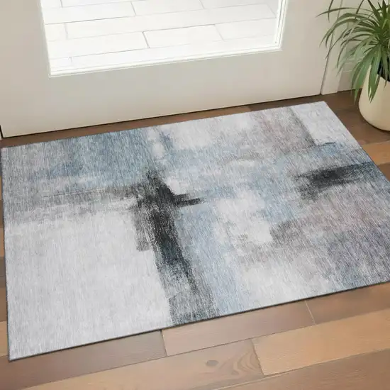 Blue Charcoal And Ivory Abstract Washable Area Rug With UV Protection Photo 1