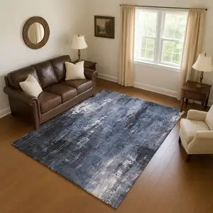 Photo of Blue Charcoal And Ivory Abstract Washable Area Rug With UV Protection